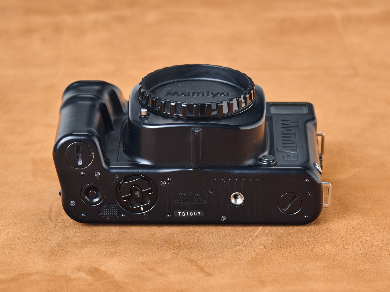 Mamiya 7ii black rangefinder film camera. Bottom view. Serial number TB1007