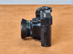 Mamiya 6 rangefinder film camera with 75mm lens. Side view.