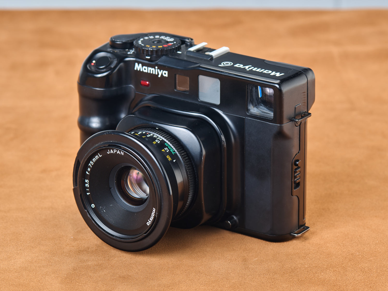 Mamiya 6 medium format rangefinder camera with 75mm lens side view