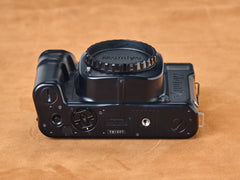 Mamiya 7ii black rangefinder film camera. Bottom view. Serial number TB1007